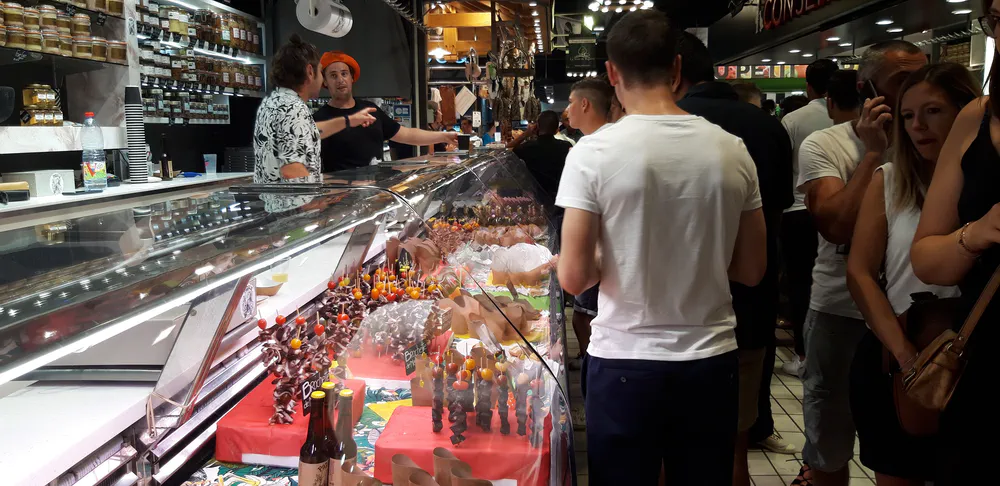 Local specialty stalls at the Marché Victor Hugo, an iconic market to see in Toulouse.