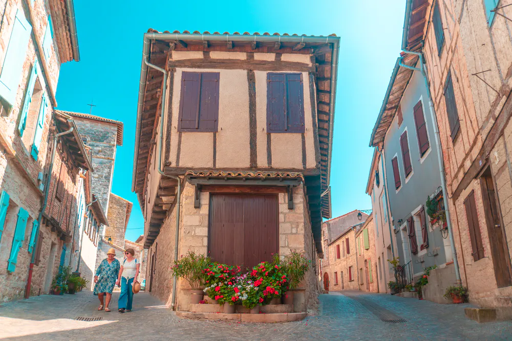 Typical corner with half-timbered house in Castelnau-de-Montmiral, a postcard from the southwest of France.