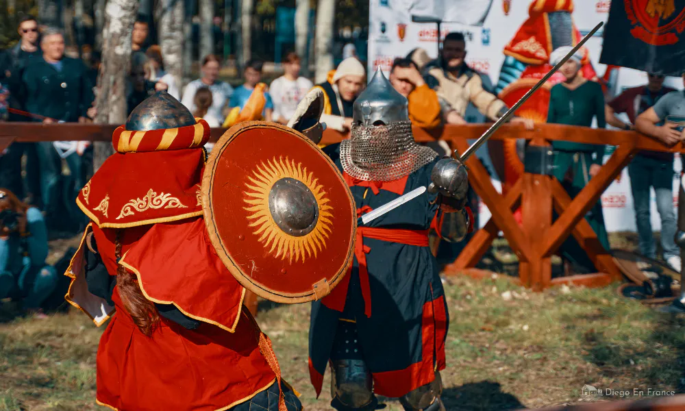 Actors dressed as knights in a staged sword fight during Bruniquel’s annual medieval fair.