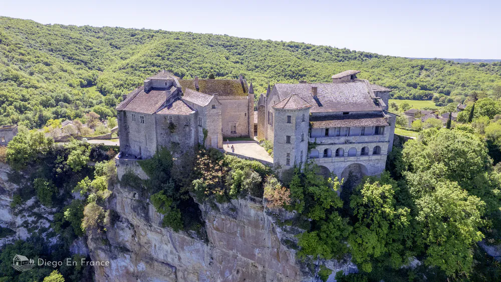 Aerial view of the medieval castles of Bruniquel on a cliffside in Occitanie, France.