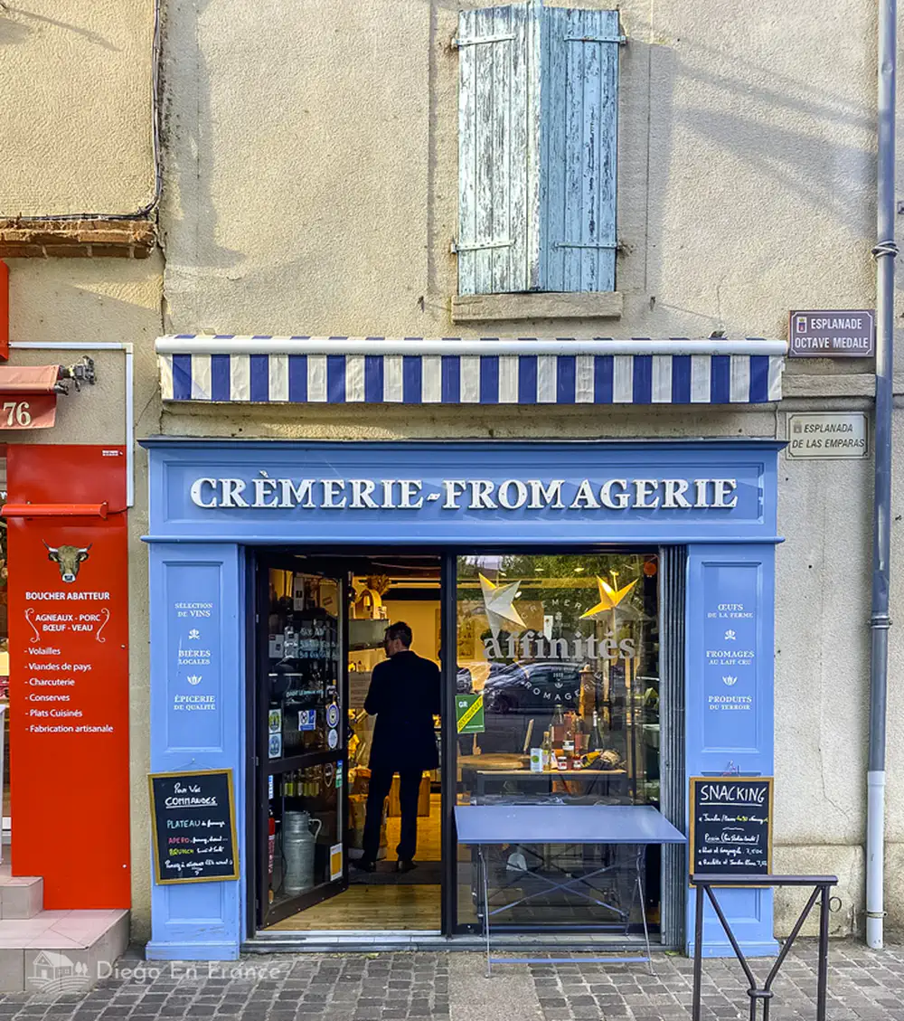 Traditional cheese and creamery store in Saint-Sulpice-la-Pointe with a blue facade and authentic charm.