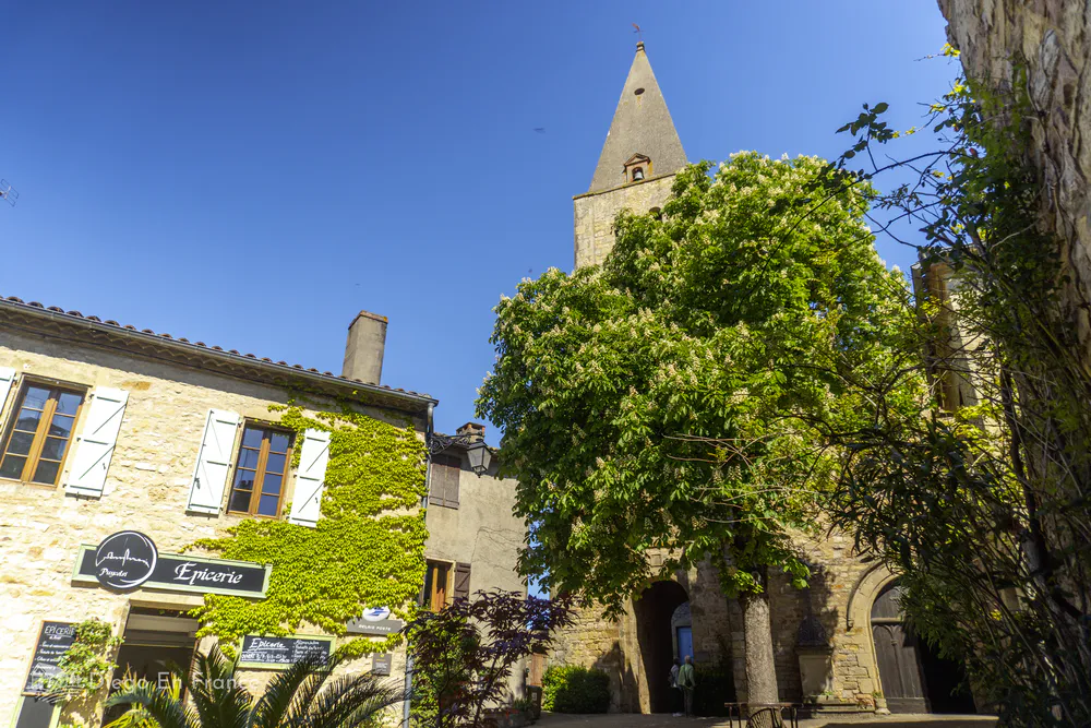 Entrance of the Église Saint-Corneille de Puycelsi, a 14th century Gothic jewel in the heart of the village.