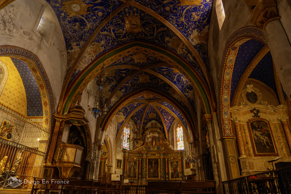 Painted ceiling and stained glass windows of the Saint-Corneille church, an artistic treasure of the Tarn.